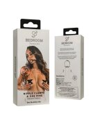 BEDROOM FANTASIES Set BDSM Nipple Clamps & Gag Ring conține cleme pentru sfârcuri și inel cu căluș reglabil din silicon și piele ecologică negru și argintiu